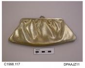 Bag, clutch bag, gilt frame with snap shut, gold plastic imitation leather, cream satin, approximate width of frame 150mm, approximate width of bag 220mm, approximate depth 100mm, c1971