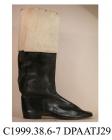 Boot, one only, men's, occupational uniform, black leather riding boot with buff leather top still covered with retailer's protective paper, squared toe, galosh with straight side seams, straight rear seam to leg of boot covered strip of matching black 