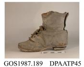 Boot, one only, child's, black leather, curved top edge, front laced nine pairs of eyelets, laces and tongue missing, rounded toe, curved side seams, straight rear seam, now split, leather sole, heel piece detached, damaged and dirty, approximate length