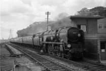 Digital image copy at 800 dpi of an original black and white print photograph retained by donor of Mike Peart, showing an merchant Navy locomotive 35017 "Belgian Marine" at Southampton Central Station.