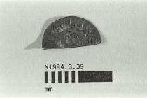 Half a coin, halfpenny, part of a hoard found at White Lane, Greywell, Mapledurwell and Up Nately, Hampshire in 1989, issued by Henry III, minted by the moneyer Nicole in London, 1248-1250