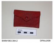 Purse, small, red leather tooled with pattern of squares, envelope style with red covered press-stud closure, unlined, external pocket at rear, approximate width 85mm, approximate depth 55mm, c1930-1935