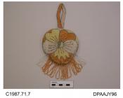 Bag, small, shaped like a pansy, closely beaded all over in yellow, tangerine and clear beads with silver and green detail, narrow beaded strap handle, lower edge trimmed long looped fringe of tangerine and clear beads, lined white silk, approximate wid