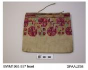 Bag, embroidered cotton on linen, upper portion embroidered with geometric design in carmine, pale green and yellow, cord handles almost entirely missing, approximate width 210mm, approximate depth 190mm, c1870-1910