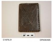 Wallet, brown leather, with tooled designs on both back and front, interlaced pattern on front, HB monogram on back, edges whipped leather thonging, mother of pearl press-stud closure on one of the inside pockets, two internal pockets plus one double po