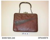 Handbag, brown morocco leather, square metal frame with slide closure and handle comprising a curved leather and metal central section attached to chain links either side, external front pocked trimmed oblique leather trim in dark brown calf, lined crea