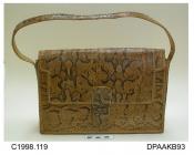 Handbag, snakeskin, possibly python, stiff, single strap handle to match, edges whipped with leather thonging, slotted tab closure, lined plain leather, internal pocket with zip closed coin section, vanity mirror, approximate width 290mm, approximate de