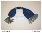 Purse, long, netted mid blue silk, one end trimmed large steel beaded tassel, the other end flat with deep fringe of cut steel beads, pair cut steel rings, approximate length excluding trims 260mm, c1840-1860
