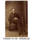 Photograph, Father Andrew Guidez seated with a book on his lap, 1864vol 1, page 8