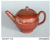 Teapot, red stoneware, globular shape, lead glazed inside and out, bands of engine-turned decoration, reeded handle, not marked, possibly made in Fenton area, Stoke-on-Trent, Staffordshire about 1765