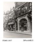 Photograph, black and white, showing decorated shops, in honour of King George V Silver Jubilee, Winchester Street, Basingstoke, Hampshire. 1935