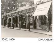 Photograph, black and white, showing decorated shops, in honour of King George V Silver Jubilee, Wote Street, Basingstoke, Hampshire. 1935