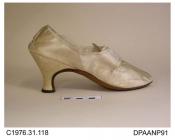 Shoes, pair, women's, cream satin, lined white linen, long latchets for buckle closure, all edges bound cream silk ribbon, straight side seams, pointed toe, pointed tongue lined cream satin, high curved Italian heel, leather sole, approximate overall le