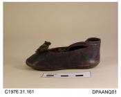 Shoes, pair, child's, bronze kid, ankle strap, flat, straights, trimmed brown silk ribbon bow and gilt beadwork detail, beading missing on one shoe, edges bound matching brown silk ribbon, broad rounded toe, ankle strap with brown button closure, lined 