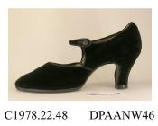 Shoes, pair, women's, black velvet, edges bound black ribbon, single bar strap with black button, lined beige cotton, rounded toe, high straight Louis heel, leather sole, approximate length overall 225mm, approximate heel height 65mm, approximate width 