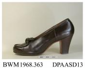 Shoes, pair, women's, dark brown calf, blunt rounded toe, apron of vamp outlined in raised piping which then forms a double bow trim, straight side and rear seams, stamped inside Delman, high square Louis heel, leather sole, approximate length overall 2