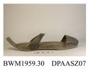 Pattens, pair, shaped wooden sole with low wedge heel and square toe, central groove roughly cut in underside of sole with strips of leather nailed to either side, strips of leather nailed to underside of heel, black leather latchets, ties missing, piec