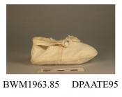 Shoes, pair, child's, cream wool, ankle strap with white button closure, edged buttonhole stitch in cream silk, unlined, broad rounded toe, trimmed with pompom of matching silk thread, flat woolen sole, approximate length overall 110mm, approximate widt