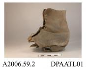 Boot, remaining portion of, one only, girl's or women's, ankle boot, black leather, front laced with nine pairs of eyelets, tongue missing, leather lined, curved top, forefoot entirely missing, shank clearly visible, straight rear seam, remains of leath
