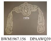 Cap, day cap, women's, braid lace with lappets, a flower motif at the end of each lappet and in centre of cap, approximate length including lappets 480mm, approximate depth of cap 190mm, c1880s