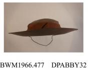 Hat, women's, fine shiny tagel straw, mid brown, shallow oval crown trimmed deep band of toning brown petersham,  flat bow of matching petersham in front,  unlined, deep inner band of brown taffeta, approximate height 60mm, approximate depth 310mm, c193