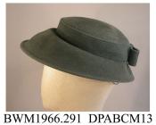Hat, women's, blue-grey fur felt, shallow crown trimmed wide hatband of matching felt with topstitched detail and large flat felt bow to rear, wide downward curved brim tapering to rear, wired edge to brim, inner band of narrow fawn petersham, printed f