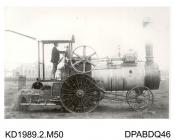 Photograph, black and white, showing a straw burning traction engine with Argentine type wheels, built by Tasker and Co, Waterloo Foundry, Anna Valley, Abbotts Ann, Hampshire
