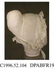 Night cap, cap, women's, spot embroidered white muslin, front edge trimmed double frill of Midlands lace, headpiece of spot muslin with piped edge, caul of matching muslin, inset band of floral whitework with needle infill, puffed horseshoe shaped crown