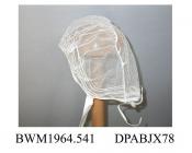 Baby's cap or undercap, net, closely gathered round face to give puffed effect, front edge bound with narrow tape and trimmed with four lines of thick white thread run through net to give piped effect, horseshoe crown of coarser net, linen tape ties, fr