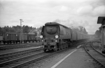 Digital image copy at 800 dpi of an original black and white print photograph retained by donor of Mike Peart, showing a West Counrty class locomotive 34103 travelling into Winchester City Station with a cross country train from the North to Bournemouth and Poole.
