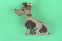 Toy dog, hand painted wooden dog, with movable head, in seated position with ears pricked up, black and tan patches and a red collar, mid 20th century?