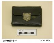 Purse, black leather, lined cream kid, fold-over style with metal slide closure, inside front flap stamped in gold A L Smith, Portswood, five internal compartments plus one for stamps, fitted notepad and pencil, approximate width 98mm, approximate depth