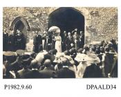 Postcard, sepia, showing a royal visit by King George V (Duke of York) and Queen Mary, St Cross, Winchester, Hampshire. 1910