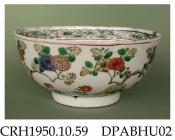 Bowl, hard paste porcelain, decorated with flowers in famille verte colours, a diaper border inside rim and a flower and scrolled motif in centre of well; painted 'hua' mark on base, made in Jingdezhen, Jiangxi Province, China, c1662-1722
the 'hua' mark