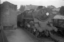 Digital image copy at 800 dpi of an original black and white print photograph retained by donor of Mike Peart, showing British Railways standard class 5, 75076, Winchester City Station.