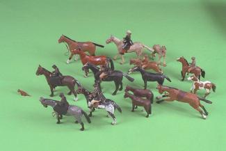 Model animals, 50 carved wooden New Forest Animals and people, the models are carved in 3 separate pieces; 2 sides with 2 legs each and a centre piece with head and tail, these were then stuck together, carved by hand to shape the animals contours and f