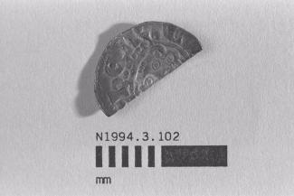 Half a coin, halfpenny, part of a hoard found at White Lane, Greywell, Mapledurwell and Up Nately, Hampshire in 1989, issued by Henry III, minted by the moneyer Ricard, 1251-1272