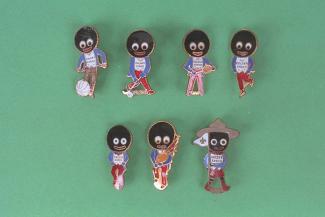 Badge, 7 Robertson's Golly badges, enamelled, made in Birmingham, West Midlands, c1960s
the badges are; footballer, hockey player, tennis player, skater, runner, piper, and a scout