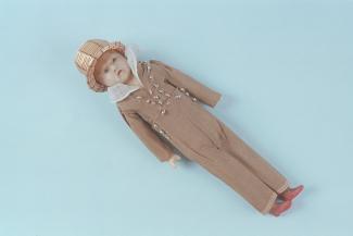 Doll, wax shoulder head and arms, stuffed linen body, red sealing wax feet, wearing a brown jacket and trousers with silver bead detail, white collar and straw hat, c1810-1819
the doll was bought at Lymington Fair in 1829 and dressed by Ann and Emma Fle