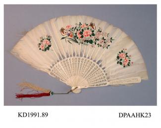 Fan, white goose feather leaf painted with dark green and pink flowers in three distinct blocks, pierced and fretted ivory sticks and guards, traces of outer border of white marabou, metal loop with two silk tassels, one magenta and the other green, app