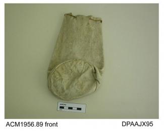 Bag, for hair powder, plain, natural hide with circular bottom, unlined, holes punched around top edge, threaded with narrow pink tape drawstring, two rough loops of leather projecting at either side of top edge, approximate depth 205mm, approximate dia