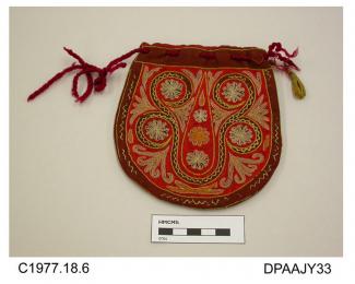 Bag, purse, small, brown wool embroidered with dense chainstitch design in red, yellow and pastel shades in the Indian style, maroon wool cord drawstring to opening, small yellow tassel attached to one side, lined red wool with internal pocket marked A.