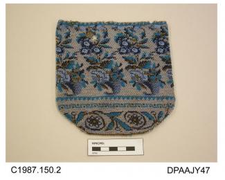 Bag, or reticule, closely beaded all over with design in shades of blue plus gold detail, upper portion with cornucopia and flowers, lower portion with band of stylized flowers and tendrils, unlined, original rings and drawstring missing, damaged, appro