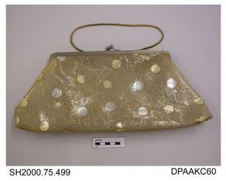 Evening bag, PVC with silver and gold discs overlaid with filligree pattern, on white metal frame with twist knob closure, fine flexible golden metal chain handle, unlined, approximate width 390mm, approximate depth 170mm, c1950-1960s
