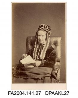 Photograph, Mrs Lucy Mary Nangle, wearing a cap with ribbons and seated with a book, taken by The London Stereoscopic and Photographic Companyvol 1, page 5 - The Family and Connections