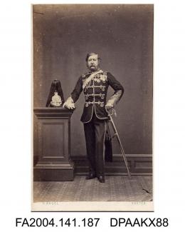 Photograph, General Jones of the 6th Dragoon Guards, standing in full dress uniform with his helmet on a plinth, taken by Owen Angel of Exeter
vol 1, page 26 - Military Witnesses for the Defendants