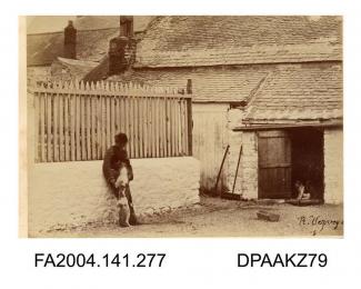 Photograph, the kennels of the harriers at Cahir Barracks, showing a man with a dog jumping up, taken by R Vervega, probably circa 1869vol 1, page 34 - Views of Cahir Barracks
