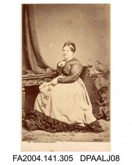 Photograph, Mrs E Abigail Laws, seated by ornate furniture and pot plant, taken by The London School of Photographyvol 1, page 38 - Witnesses for the Defendants