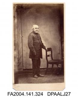 Photograph, Mr George Notcutt, postman at Rotherhithe, standing by a chair, taken by Mrs Catlin of Rotherhithe, Londonvol 1, page 40 - In T v. L Witnesses for the Defendants