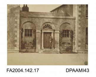 Photograph, an entrance to the officers' quarters at Clonmel Barracks with a soldier standing on the front doorstep, possibly taken by R Vervega, 1869vol 2, page 19
